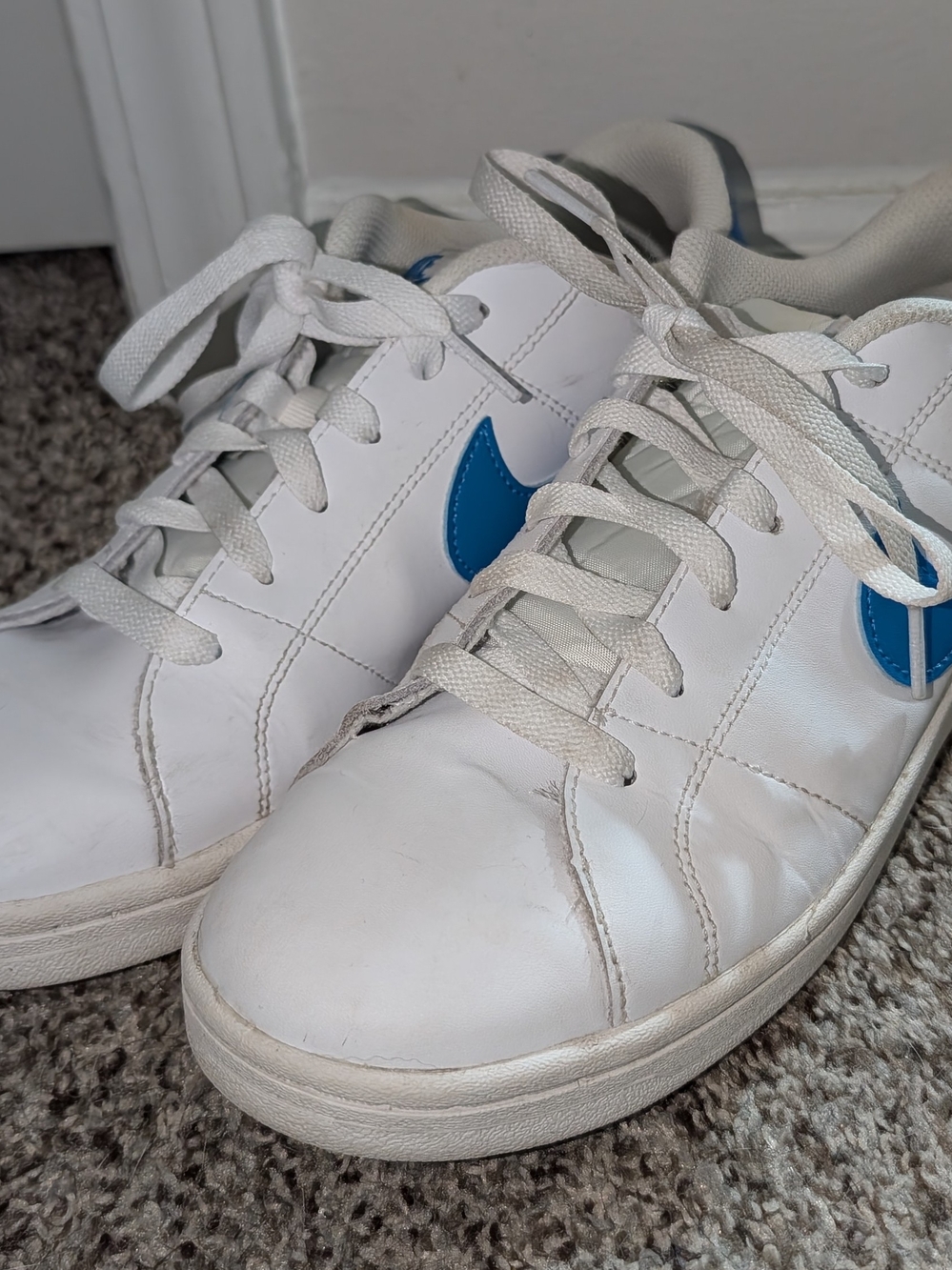 Nike White Sneakers with Blue Swoosh